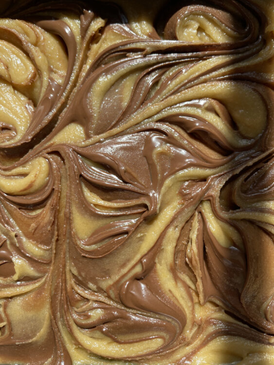 overhead view of raw nutella blondies with a swirl