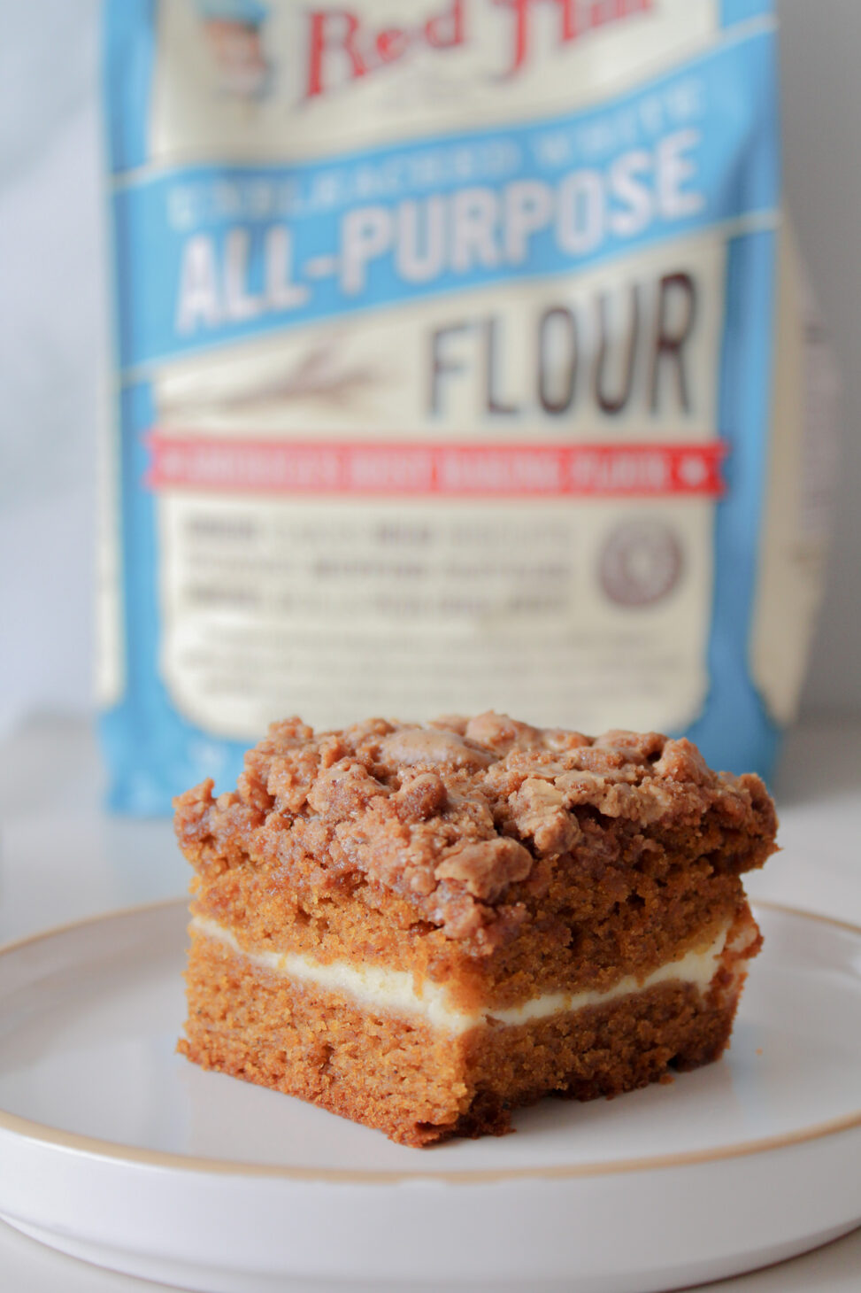 image of pumpkin spice latte coffee cake recipe in front of flour