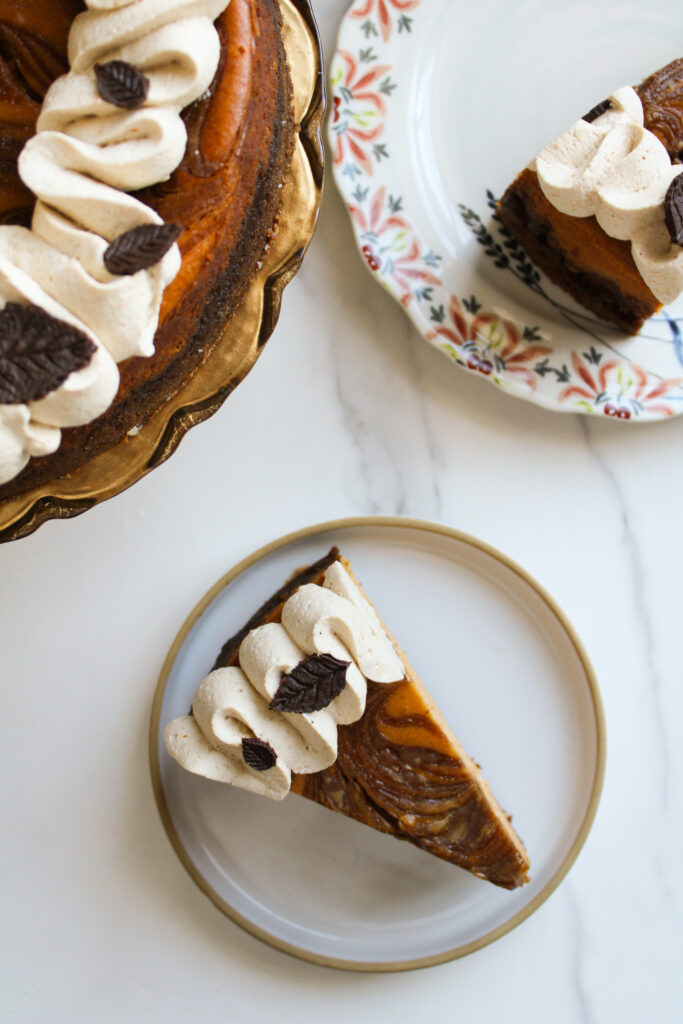 Slices of pumpkin swirl cookie butter cheesecake