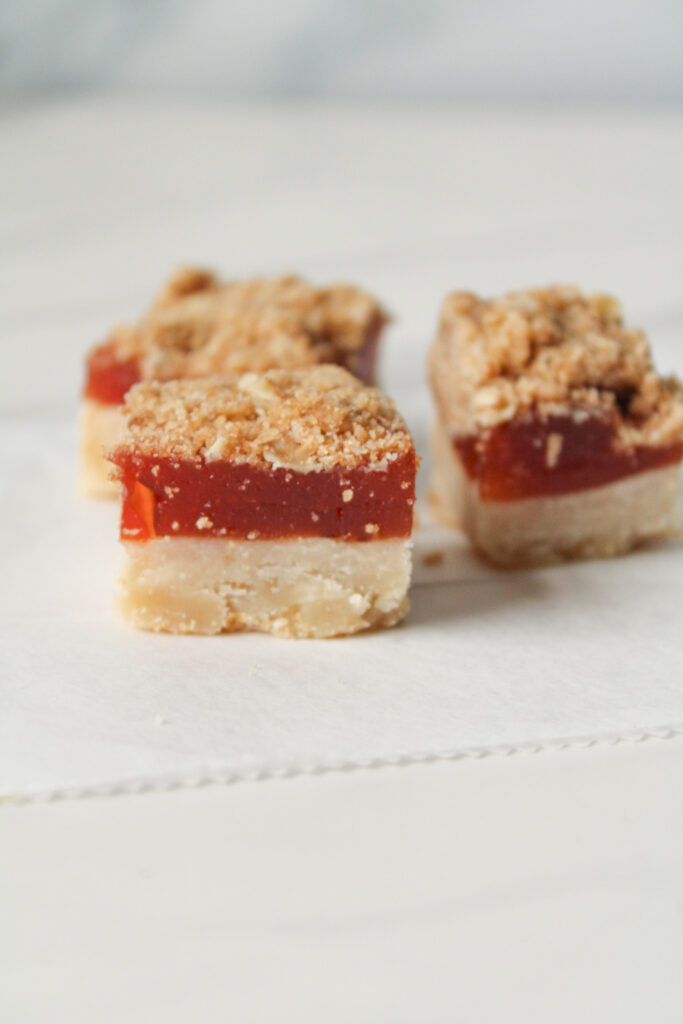 3 Guava shortbread bars on a white backdrop