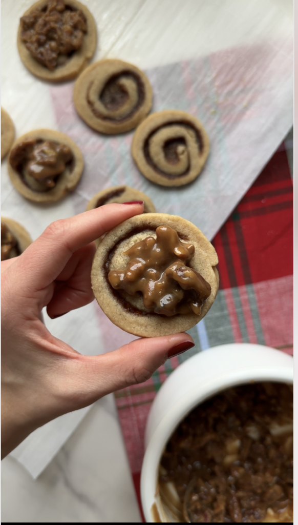 Hand holding Pecan Sticky Bun Cookies