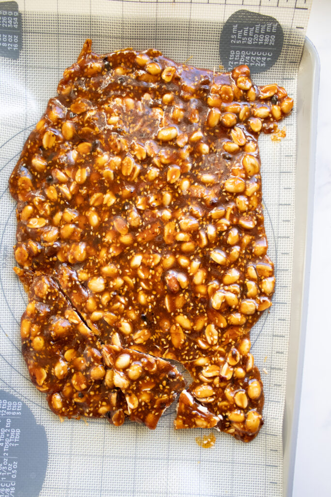 Chili-Crunch-Peanut-Brittle on a silicone mat
