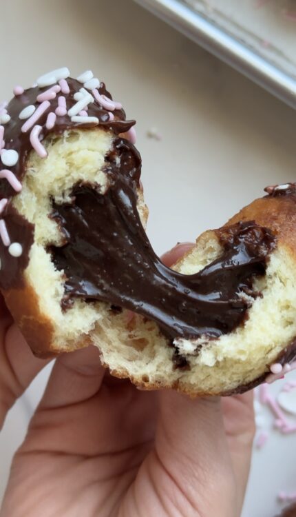 Brownie Batter doughnut being pulled open, brownie batter filling