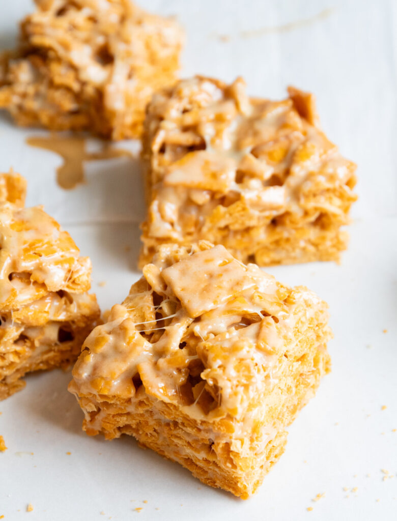 Cheez-its rice krispie treats with peanut butter on a marble surface