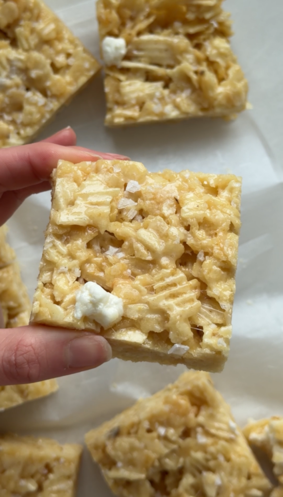hand holding a potato chip rice krispie treat 